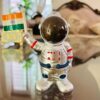 Solar-powered astronaut ornament with Indian flag waving hand Patriotic astronaut figurine for desk or car decor