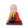 Solar-powered sitting Buddha statue with moving hands and head for dashboard or home decor